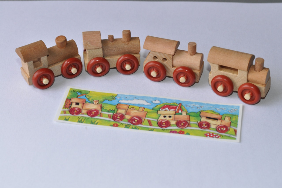 An image showcasing a rustic, handcrafted wooden toy workshop bathed in warm, golden sunlight